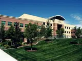 Meridian City Hall in 2024 with green grass and trees